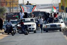 Sudanese people gather on a street and wave flags during the first anniversary of the start of the uprising that toppled long-time ruler Omar al-Bashir, in Khartoum, Sudan, December 19, 2019. PHOTO BY REUTERS/Mohamed Nureldin Abdallah