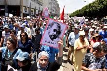 A protester holds a portrait of protest movement leader Nasser Zefzafi and shouts slogans during a demonstration against corruption and official abuses, in the Rif region in Rabat, Morocco, June 11, 2017. PHOTO BY REUTERS/Stringer