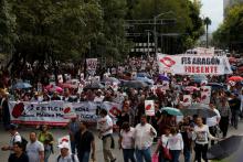 Union workers and farmers protest as NAFTA renegotiation begins in Washington, D.C., in Mexico City, Mexico August 16, 2017. The placards read " FTA hurts, Mexico better without FTA". PHOTO BY REUTERS/Carlos Jasso