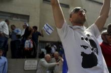 A ring-wing protester and supporter of Im Tirtzu, an ultra-nationalist Israeli group, wearing a shirt with an image of Zionist leader Theodor Herzl, demonstrates against an event held by a group of left-wing artists and academics, outside the Independence Hall in Tel Aviv, April 21, 2011. PHOTO BY REUTERS/Nir Elias