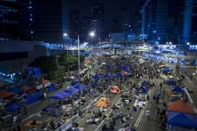 Protesters of the Occupy Central movement sleep in tents as pro-democracy protesters continue blocking areas around the government headquarters building in Hong Kong