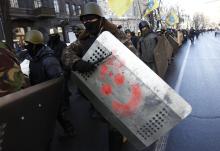 Anti-government protesters march on the streets in Kiev February 6, 2014. The parties in Ukraine's deadlocked parliament agreed on Thursday to try to draft a joint bill on constitutional amendments that could be put to a vote