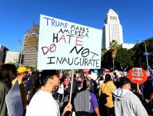 Protesters hold up signs during a march and rally against the United States President-elect Donald Trump in Los Angeles, California, U.S., December 18, 2016. PHOTO BY REUTERS/Kevork Djansezian