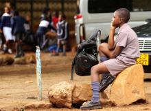 A Zimbabwean schoolchild awaits transport from school during a teachers' strike in Harare, Zimbabwe, February 8, 2019. REUTERS/Philimon Bulawayo