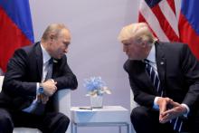 Russia's President Vladimir Putin talks to U.S. President Donald Trump during their bilateral meeting at the G20 summit in Hamburg, Germany, July 7, 2017. PHOTO BY REUTERS/Carlos Barria