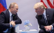 U.S. President Donald Trump speaks with Russian President Vladimir Putin during their bilateral meeting. PHOTO BY REUTERS/Carlos Barria