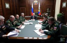 Russia's President Vladimir Putin (C) meets with the commanders of Russian military districts and the Northern Fleet as part of a session of the Defence Ministry Board in Moscow, Russia, December 18, 2018. PHOTO BY REUTERS/Sputnik/Mikhail Klimentyev/Kremlin