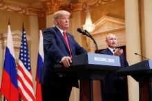 Russia's President Vladimir Putin gestures during a joint news conference with U.S. President Donald Trump after their meeting in Helsinki, Finland, July 16, 2018. PHOTO BY REUTERS/Kevin Lamarque