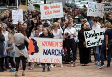 Participants of a rally regarding women's rights hold placards as they march in Wellington, New Zealand, January 21, 2017 the day after Donald Trump's inauguration as President of the United States. PHOTO BY REUTERS/Joshua Gimblett