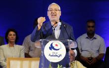 Rached Ghannouchi, leader of Tunisia's main Islamist Ennahda party, gives a speech during a meeting