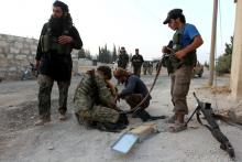 Rebel fighters prepare their weapons in an artillery academy of Aleppo, Syria, August 6, 2016. PHOTO BY REUTERS/Ammar Abdullah