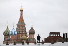 A man walks along Red Square, with the mausoleum of Soviet state founder Vladimir Lenin (R) and St. Basil's Cathedral seen in the background, in central Moscow, Russia, December 21, 2015. PHOTO BY REUTERS/Maxim Shemetov