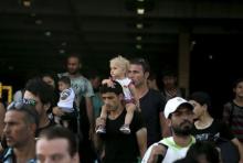 Refugees and migrants arrive onboard the Eleftherios Venizelos passenger ship at the port of Piraeus, near Athens, Greece, September 4, 2015. PHOTO BY REUTERS/Alkis Konstantinidis