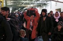 Refugees and migrants arrive aboard the passenger ferry Eleftherios Venizelos at the port of Piraeus, near Athens, Greece, February 1, 2016. PHOTO BY REUTERS/Alkis Konstantinidis