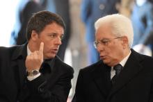 Italian Prime Minister Matteo Renzi talks to President Sergio Mattarella before a ceremony led by Pope Francis to close the Holy Door marking the closing of the Catholic Jubilee Year of Mercy in Saint Peter's Basilica at the Vatican, November 20, 2016. PHOTO BY REUTERS/Tiziana Fabi