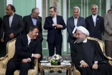 Iran's President Hassan Rouhani (R) and Italian Prime Minister Matteo Renzi attend a ceremony to sign deals in Tehran, Iran, April 12, 2016. PHOTO BY REUTERS/President.ir