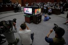 Foreign reporters gather around screens broadcasting an address by North Korean leader Kim Jong Un to the Workers' Party of Korea (WPK) congress, at a hotel in central Pyongyang, North Korea May 8, 2016. PHOTO BY REUTERS/Damir Sagolj