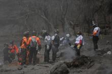 Rescue workers look for remains at an area affected by the eruption of the Fuego volcano at El Rodeo in Escuintla, Guatemala, June 6, 2018. PHOTO BY REUTERS/Jose Cabezas