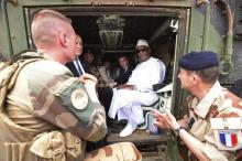 French President Emmanuel Macron (C) and French Foreign Affairs Minister Jean-Yves Le Drian (2L) talk with Mali's President Ibrahim Boubacar Keita (2R) inside a military vehicle as they visit French troops in Africa's Sahel region in Gao, northern Mali, May 19, 2017. REUTERS/Christophe Petit Tesson