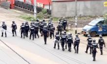 A still image taken from a video shows riot police walk along a street in the English-speaking city of Buea, Cameroon October 1, 2017. PHOTO BY REUTERS