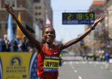 Kenya's Rita Jeptoo reacts after winning the women's division at the 118th running of the Boston Marathon in Boston, Massachusetts, April 21, 2014. PHOTO BY REUTERS/Brian Snyder