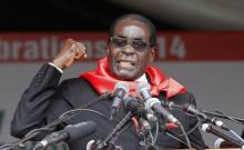 Zimbabwe President Robert Mugabe addresses supporters during celebrations to mark his 90th birthday in Marondera about 80km ( 50 miles) east of the capital Harare, February 23, 2014. PHOTO BY REUTERS/Philimon Bulawayo