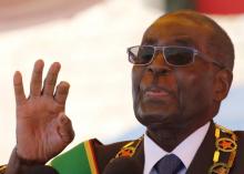 Zimbabwe's President Robert Mugabe gestures as he addresses a gathering in a speech to mark the National Heroes Day celebrations in the capital Harare, Zimbabwe August 8, 2016. PHOTO BY REUTERS/Philimon Bulawayo