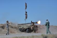 Shi'ite fighters fire a rocket toward Islamic State militants on the outskirts of Fallujah, west of Baghdad. PHOTO BY REUTERS/Stringer