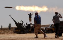 Anti-Gaddafi fighters fire a multiple rocket launcher near Sirte, September 24, 2011. PHOTO BY REUTERS/Goran Tomasevic