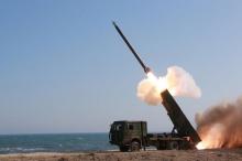 A rocket is launched during a demonstration of a new large-caliber multiple rocket launching system attended by North Korean leader Kim Jong Un (not pictured) at an unknown location, in this undated photo released by North Korea's Korean Central News Agency (KCNA) on March 22, 2016. PHOTO BY REUTERS/KCNA