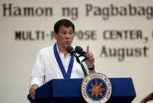 Philippine President Rodrigo Duterte gestures while delivering a speech during the 115th Police Service Anniversary at the Philippine National Police (PNP) headquarters in Quezon city, metro Manila, Philippines, August 17, 2016. PHOTO BY REUTERS/Noel Celis