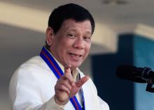 Philippine President Rodrigo Duterte gestures as he delivers his speech during the 116th Police Service Anniversary inside the Philippine National Police (PNP) headquarters in Quezon city, metro Manila, Philippines, August 9, 2017. PHOTO BY REUTERS/Romeo Ranoco