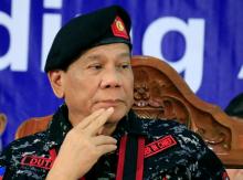 Philippine President Rodrigo Duterte, wearing a military uniform, gestures as he attends the 67th founding anniversary of the First Scout Ranger regiment in San Miguel town, Bulacan province, north of Manila, Philippines, November 24, 2017. PHOTO BY REUTERS/Romeo Ranoco