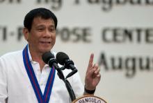 Philippine President Rodrigo Duterte gestures while delivering a speech during the 115th Police Service Anniversary at the Philippine National Police (PNP) headquarters in Quezon city, metro Manila, Philippines, August 17, 2016. PHOTO BY REUTERS/Noel Celis
