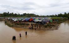 Rohingya refugees cross a stream to reach their temporary shelters at No Man’s Land between Bangladesh-Myanmar border, at Cox’s Bazar, Bangladesh, September 9, 2017. PHOTO BY REUTERS/Danish Siddiqui