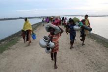Rohingya refugees walk after crossing the Naf River in Teknaf, Bangladesh, November 12, 2017. PHOTO BY REUTERS/Mohammad Ponir Hossain