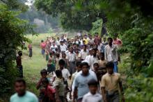Men walk at a Rohingya village outside Maugndaw in Rakhine state, Myanmar, October 27, 2016. TPHOTO BY REUTERS/MYANMAR-FACEBOOK/HATE REUTERS/Soe Zeya Tun