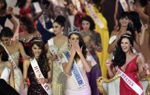 Rolene Strauss of South Africa (C) is crowned Miss World 2014 at the ExCel Centre in east London, December 14, 2014. PHOTO BY REUTERS/Toby Melville