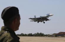 A Russian SU-33 naval fighter plane flies during a drill at the Nitka training complex in the village of Novofedorovka, west of the Crimean city of Simferopol, August 27, 2015. PHOTO BY REUTERS/Pavel Rebrov
