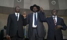 South Sudan's President Salva Kiir (C) holds hands with First Vice President Taban Deng Gai (L) and Second Vice President James Wani Igga (R) inside the Presidential Palace in the capital of Juba, South Sudan, July 26, 2016. PHOTO BY REUTERS/Adriane Ohanesian
