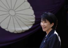 Japan's Internal Affairs and Communications Minister Sanae Takaichi speaks to the media after visiting the Yasukuni Shrine in Tokyo