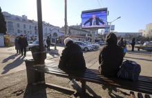 A screen, showing Russian President Vladimir Putin's annual end-of-year news conference, is on display on a street of the Black Sea port of Sevastopol, Crimea, December 17, 2015. PHOTO BY REUTERS/Pavel Rebrov