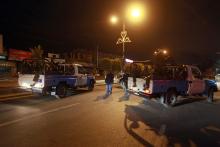 Security forces arrive at the central prison after an attack, in Sanaa