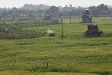 Indian security posts (R) are seen along the border between India and Pakistan in Suchetgarh near Jammu