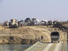 Iraqi security forces cross a bridge built by corps of engineers over the Euphrates in Ramadi, December 22, 2015. PHOTO BY REUTERS/Stringer