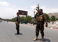 Afghan security forces keep watch at the site of a suicide attack in Kabul, Afghanistan, June 4, 2018. PHOTO BY REUTERS/Omar Sobhani