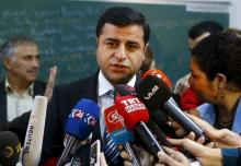 Selahattin Demirtas, co-chairman of the pro-Kurdish Peoples' Democratic Party (HDP), talks to the media before casting his ballot at a polling station during a general election in Istanbul, Turkey, November 1, 2015. PHOTO BY REUTERS/Osman Orsal