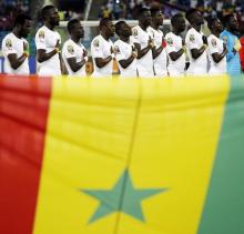 Senegal national soccer team players listen to their national anthem before the start of their Group C soccer match against Algeria in the African Cup of Nations in Malabo, January 27, 2015. PHOTO BY REUTERS/Amr Abdallah Dalsh