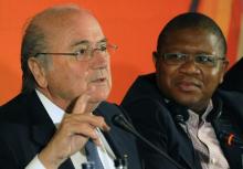 FIFA president Sepp Blatter (L) gestures next to South Africa's Sports Minister Fikile Mbalula during a media briefing in Johannesburg, May 21, 2011. PHOTO BY REUTERS/Stringer