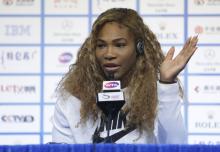 Serena Williams of the U.S. answers a question at a news conference at the China Open tennis tournament in Beijing, October 3, 2014. PHOTO BY REUTERS/Jason Lee